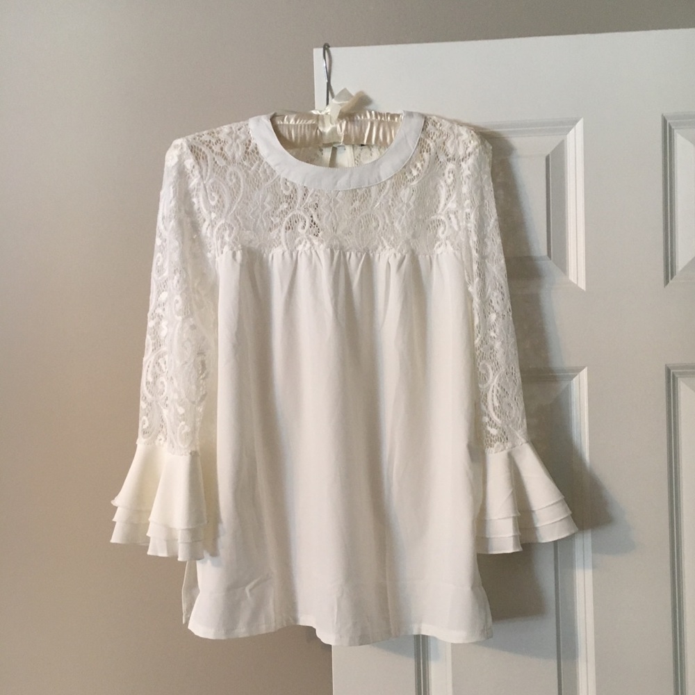 Cream blouse with lace detailing and bell sleeves